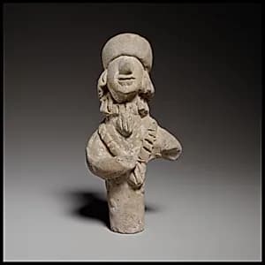 Terracotta statuette of a woman by Unknown Artist