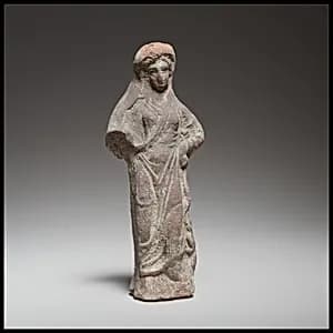 Terracotta statuette of a woman by Unknown Artist
