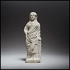 Terracotta statuette of a woman by Unknown Artist