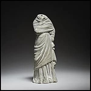 Terracotta statuette of a woman by Unknown Artist