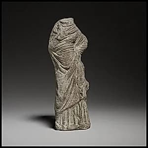 Terracotta statuette of a woman by Unknown Artist