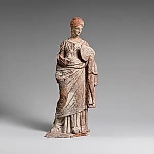Terracotta statuette of a woman by Unknown Artist