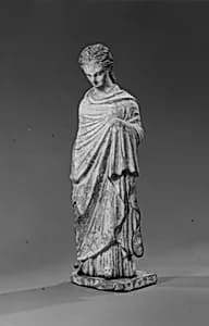 Terracotta statuette of a woman by Unknown Artist