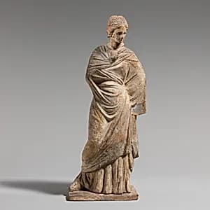 Terracotta statuette of a woman by Unknown Artist
