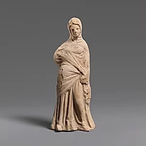 Terracotta statuette of a woman by Unknown Artist