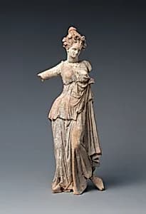 Terracotta statuette of a woman by Unknown Artist