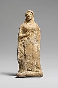 Terracotta statuette of a woman by Unknown Artist