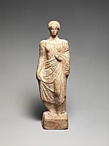 Terracotta statuette of a woman by Unknown Artist