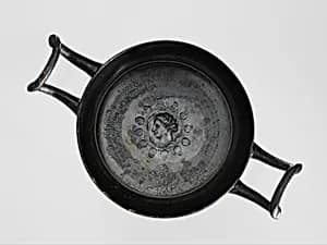 Terracotta stemless kylix (drinking cup) by Unknown Artist