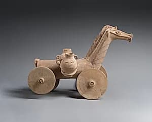 Terracotta wheeled horse by Unknown Artist