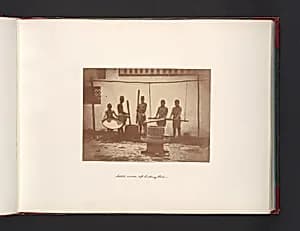 Native Mode of Hulling Rice by John Thomson