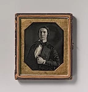[Young Man Holding Jacket Lapel] by Unknown