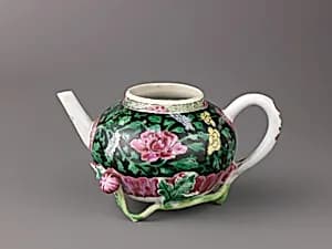 Teapot (a) and saucer (b) by Chinese