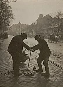 Men Working by André Kertész