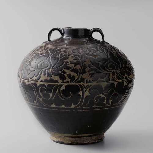 Ovoid jar with carved floral scrolls by anonymous