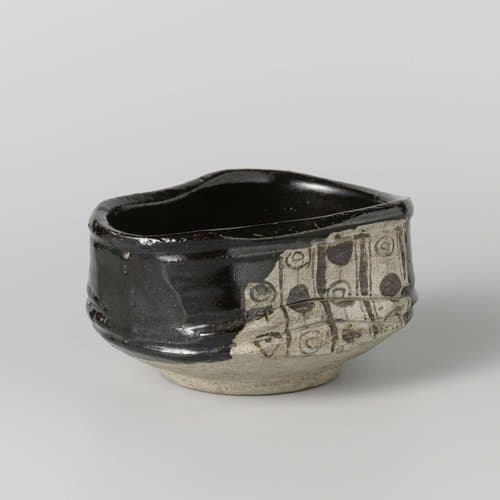 Tea bowl with a black glaze and geometrical patterns in panels by anonymous; anonymous