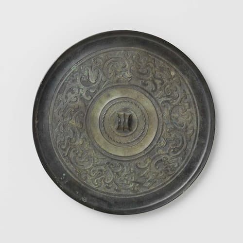 Mirror with stylized bird-dragon motifs by anonymous