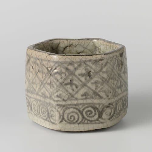 Hexagonal charcoal burner with diaper patterns by anonymous; anonymous