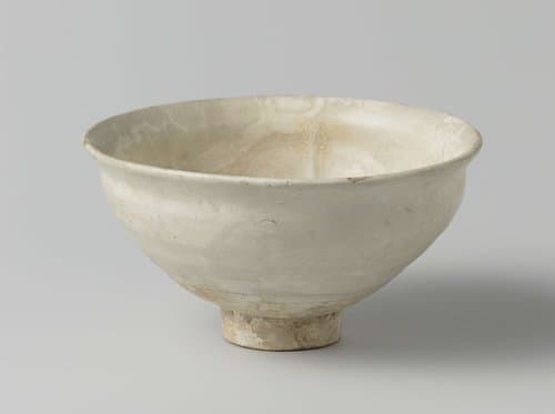 Bowl on a high footring with a white slip decoration by anonymous