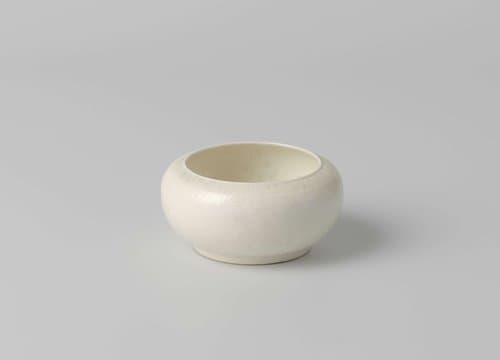 Bowl with rounded sides and a band of scroll work by anonymous