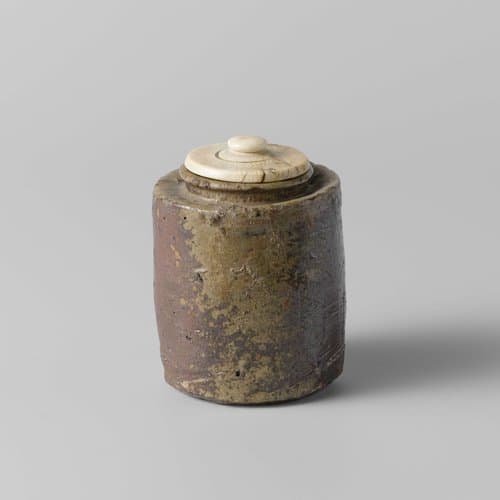Cylindrical tea caddy with a green brown glaze by anonymous