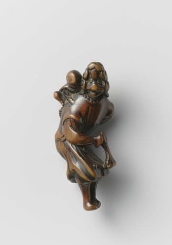 Netsuke in the form of a Dutch woman with a child by anonymous