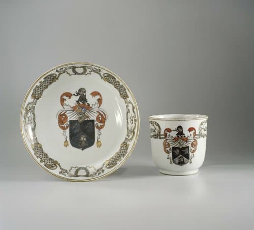 Cup with handle and saucer with the arms of the Saunders family by anonymous