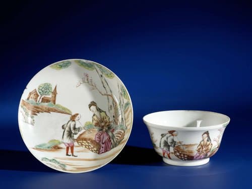 Saucer with a seated woman and a man smoking a pipe by anonymous