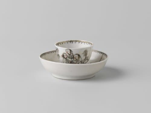 Cup and saucer with four people in a landscape by anonymous