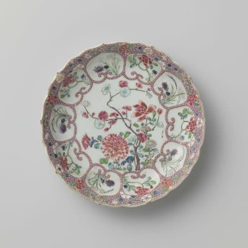 Saucer with flowering plants and flower sprays in moulded petal-shaped panels on diaper pattern by anonymous