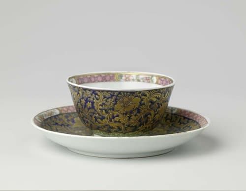 Cup and saucer and teapot stand with large floral scrolls by anonymous