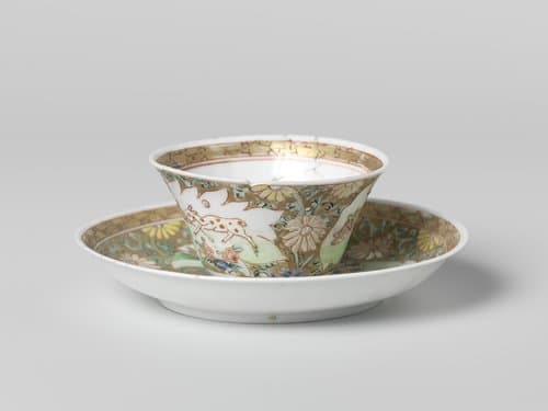 Cup and saucer with a cock and three deer in panels on a gold ground with floral scrolls by anonymous