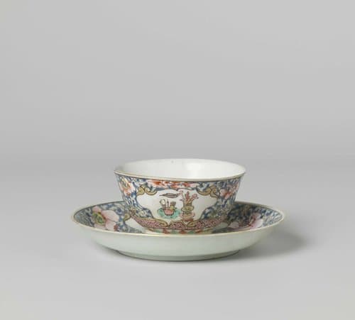 Bell-shaped cup and saucer with antiquities in panels on a ground of floral scrolls by anonymous
