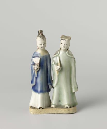 Figure of a standing man and woman with a fan by anonymous