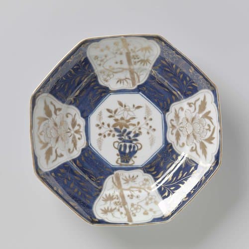 Octagonal dish with flowering plants in panels and flower sprays by anonymous