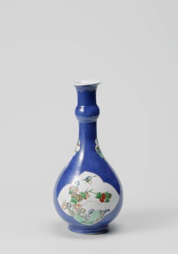 Pear-shaped bottle vase with powder blue and flowering plants near a rock by anonymous