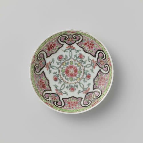 Saucer with floral scrolls in a heavily outlined by anonymous