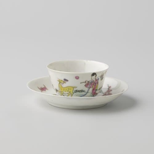 Bell-shaped cup and saucer with Lan Caihe in a landscape with a deer and bat by anonymous