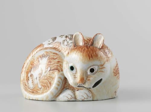 Figure (nightlight) in the shape of a pierced cat by anonymous; anonymous