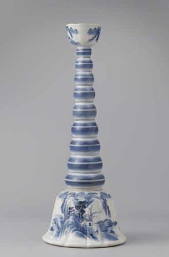 Candlestick with a conical bulb stem and candleholder and base with a water landscape by anonymous