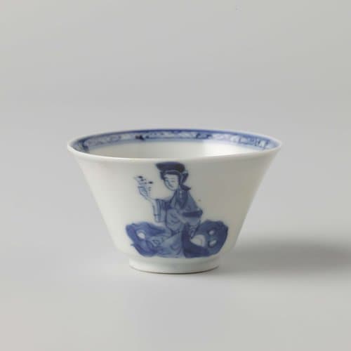 Cup with flaring sides with a woman and boy near a rock by anonymous