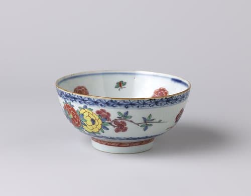 Bowl with incised floral scrolls and a bird on a flowering plant by anonymous