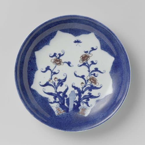 Saucer-dish with powder blue and shaped panel in reserve with flower sprays by anonymous
