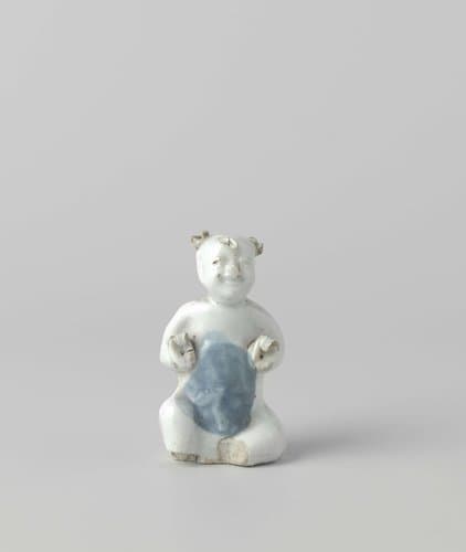 Figure of a seated boy by anonymous