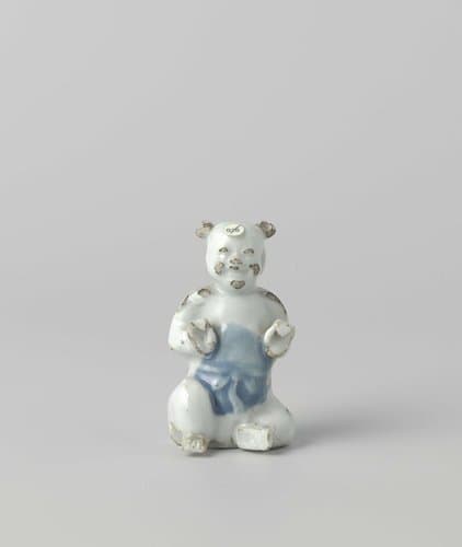 Figure of a seated boy by anonymous