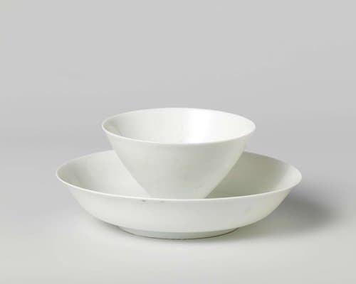 Cup and saucer with incised flower heads by anonymous