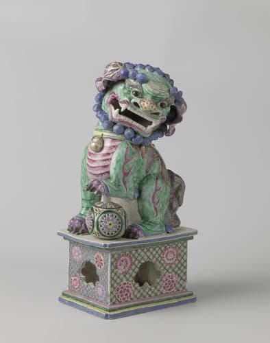 Figure of a shishi with its paw on a pierced ball by anonymous