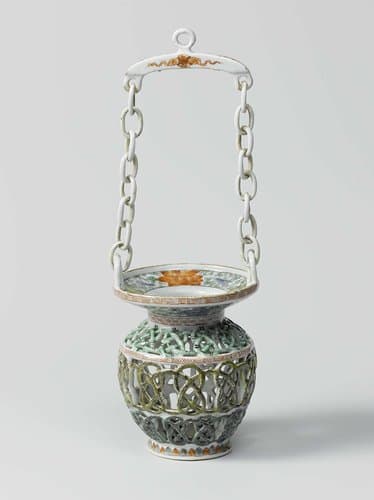 Basket with pierced body and chain by anonymous