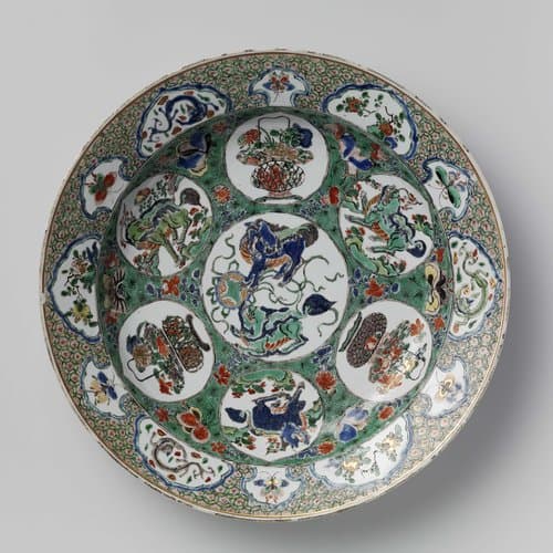 Dish with (mythological) animals, flower baskets and flowering plants by anonymous
