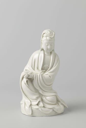 Figure of a seated Guanyin holding a scroll by anonymous